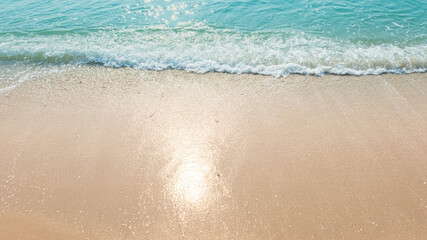 wave of blue ocean on sandy beach. texture Background.
