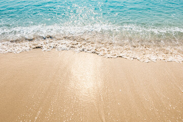 Fototapeta na wymiar wave of blue ocean on sandy beach. texture Background. 