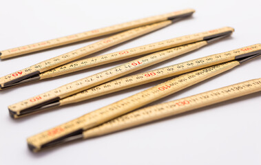 Wooden folding ruler isolated on a white background.