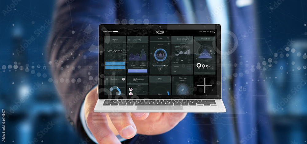 Poster businessman holding laptop with business user interface data on the screen isolated on a background