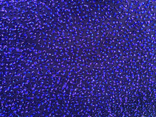 Blue disco glitter sparkling fabric background - sequin backdrop. Holiday abstract glitter texture...