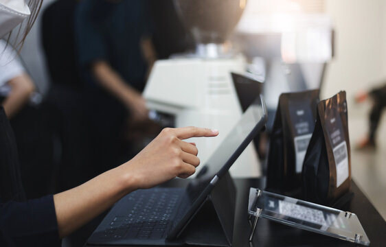 Close-up Of Hand Young Asian Woman Use Digital Tablet To Receive Orders From Customers