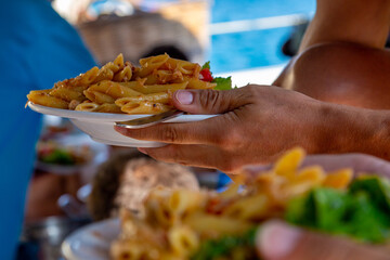 A plate of cold pasta pennes buffet on a Yacht