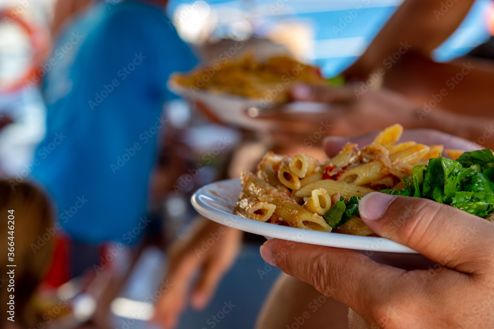 Wall mural Buffet plate of pennes pasta on a tour yacht 