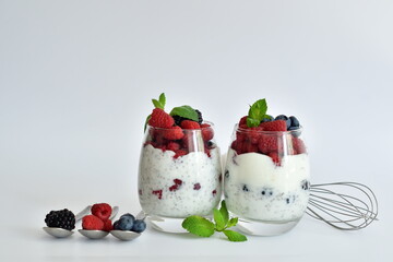 two glasses of delicious homemade smoothie, dessert made from chia and berries. delicious milkshake, vegan raw food. Healthy food and breakfast. Good morning.Selective focus