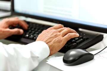 Closeup on a Businessman Working with Computer