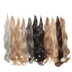 a collection of different colors of clip in wavy synthetic hair extensions