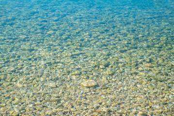 Fototapeta na wymiar clear transparent water in the sea visible bottom.
