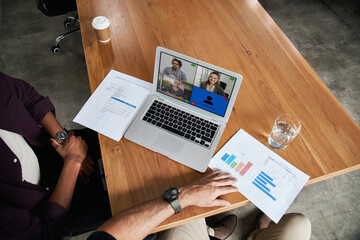 Businesspeople video conferencing with a colleagues working at home