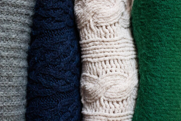 A stack of warm sweaters. Close up.