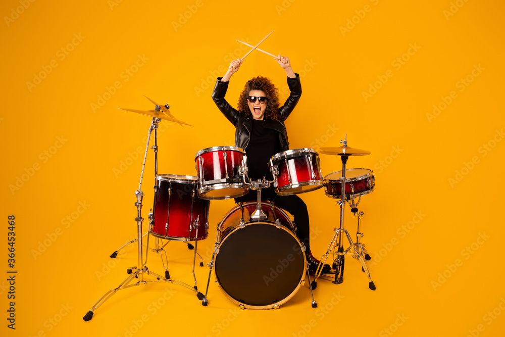 Sticker Full body photo of popular rocker redhair lady plays instruments beat raise hands drum sticks concert sound check repetition wear black leather outfit sun glasses isolated yellow background