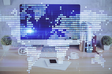 Double exposure of business theme icons and work space with computer background. Concept of success.