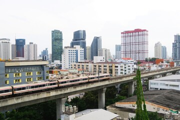 Fototapeta na wymiar Airport express train riding in the city center of Bangkok