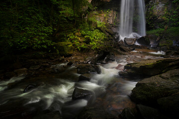 The moody and beautiful tall waterfall in Resolven, near Neath, South Wales, UK
