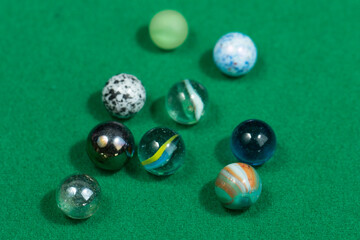Colorful Marble Balls on Green background. Abstract Pattern