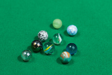 Colorful Marble Balls on Green background. Abstract Pattern