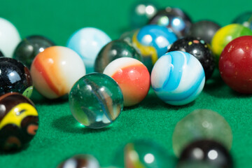 Colorful Marble Balls on Green background. Abstract Pattern