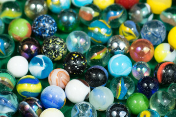 Fototapeta na wymiar Colorful Marble Balls on Green background. Abstract Pattern