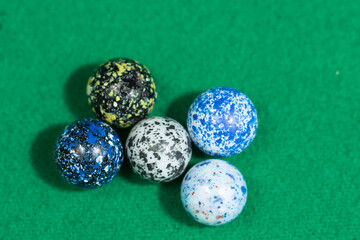 Colorful Marble Balls on Green background. Abstract Pattern