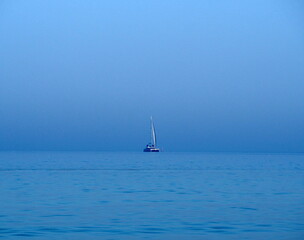 Sailboat in the blue sea