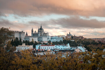 image of a sunset of the royal palace and the almudena cathedral in madrid