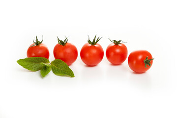 cherry tomatoes in a row on a white background