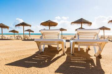 Empty deck chairs at beach during quarantine times