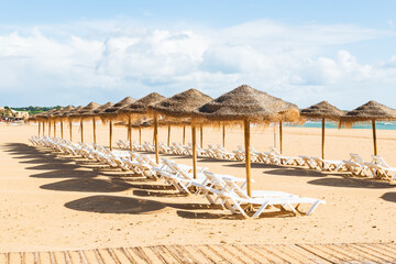 Empty deck chairs at beach during quarantine times