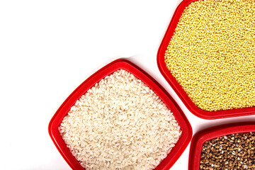 buckwheat, rice and wheat on a white background