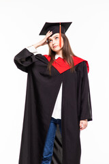 Graduating student girl in an academic gown isolated over white background.