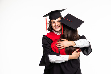 Happy graduated young students couple hugging isolated on white background