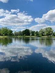 Fototapeta premium Clouds reflection in the lake water, natural colors, lake background
