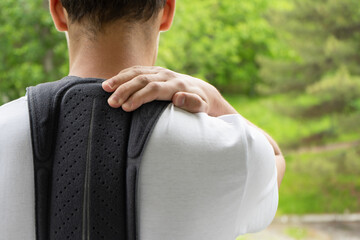 Orthopedic corset on the man body, back brace. The teenage in the corrector for the spine on a...