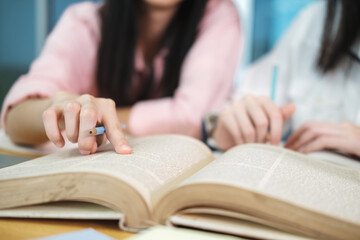 Young students campus helps friend catching up and learning.