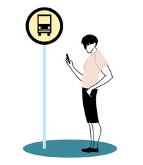 Young man staying at the bus stop with the cell phone