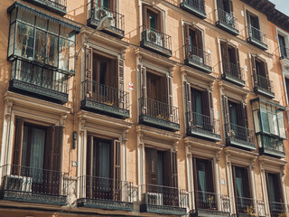 Fototapeta na wymiar Facade of an old building in Madrid. Nice design. Spring day
