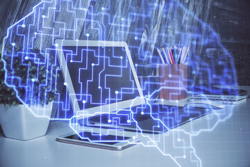 Multi exposure of work table with computer and brain hologram. Brainstorm concept.