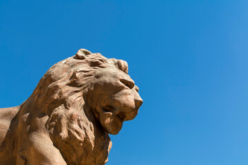 Lion statue isolated on blue sky