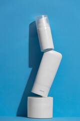 Set of blank white skincare cosmetic products on background with free space for advertising text.