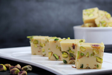 Milk Burfi is popular Indian sweet or Mithai also known as Mawa Burfi or khoya burfi or Milk burfi made with milk,sugar ,desi ghee and dry fruits during festival seasons.