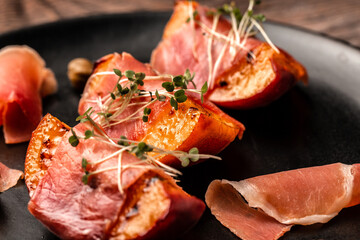 appetizer Grilled peach with prosciutto, capers, microgreen, Food recipe background