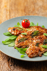 Saltimbocca. Veal schnitzel with sage and Parma ham. Italian specialty. Front view.