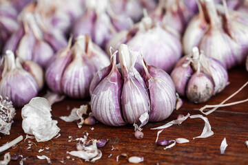 Organic garlic on wood background. Fresh herbs and spices. 