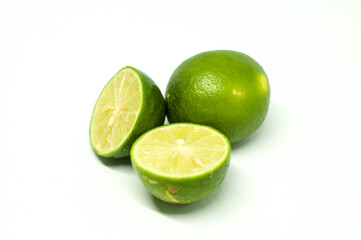 Sliced Fresh Lime with One Behind Isolated in White Background