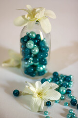 Glass bottle with green pearl beads