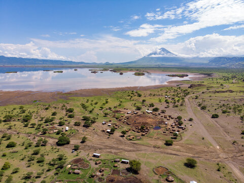 Aerial view of Maasai boma or family rural village on the coast of Salty lake Natron in the Great Rift Valley, Tanzania