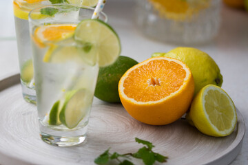 Water with fresh orange, lemon and lime slices.