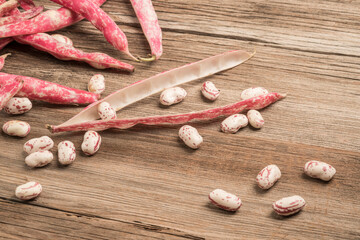 raw kidney beans on a wooden table