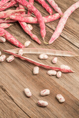 raw kidney beans on a wooden table