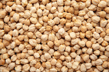 Dry raw organic chickpeas background. Top view